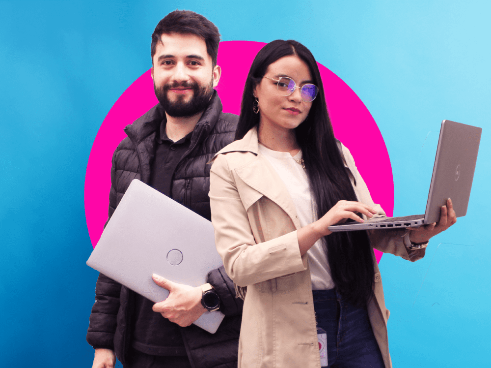 A man and woman holding laptops.